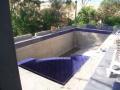 The stringlines shown here were for setting out the pool coping. I covered up small irregularities in the shell by slightly increasing or decreasing the ovehang of the bullnose edges on each side of the pool to get a line of best fit.
