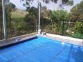 I used an acrylic render on the pool hob to provide a true surface for tiling. Note the solar blanket on the pool. A receipt for a solar blanket is required before the pool can be filled. Sizing your pool to fit a standard solar blankets modular component width will save some money.
